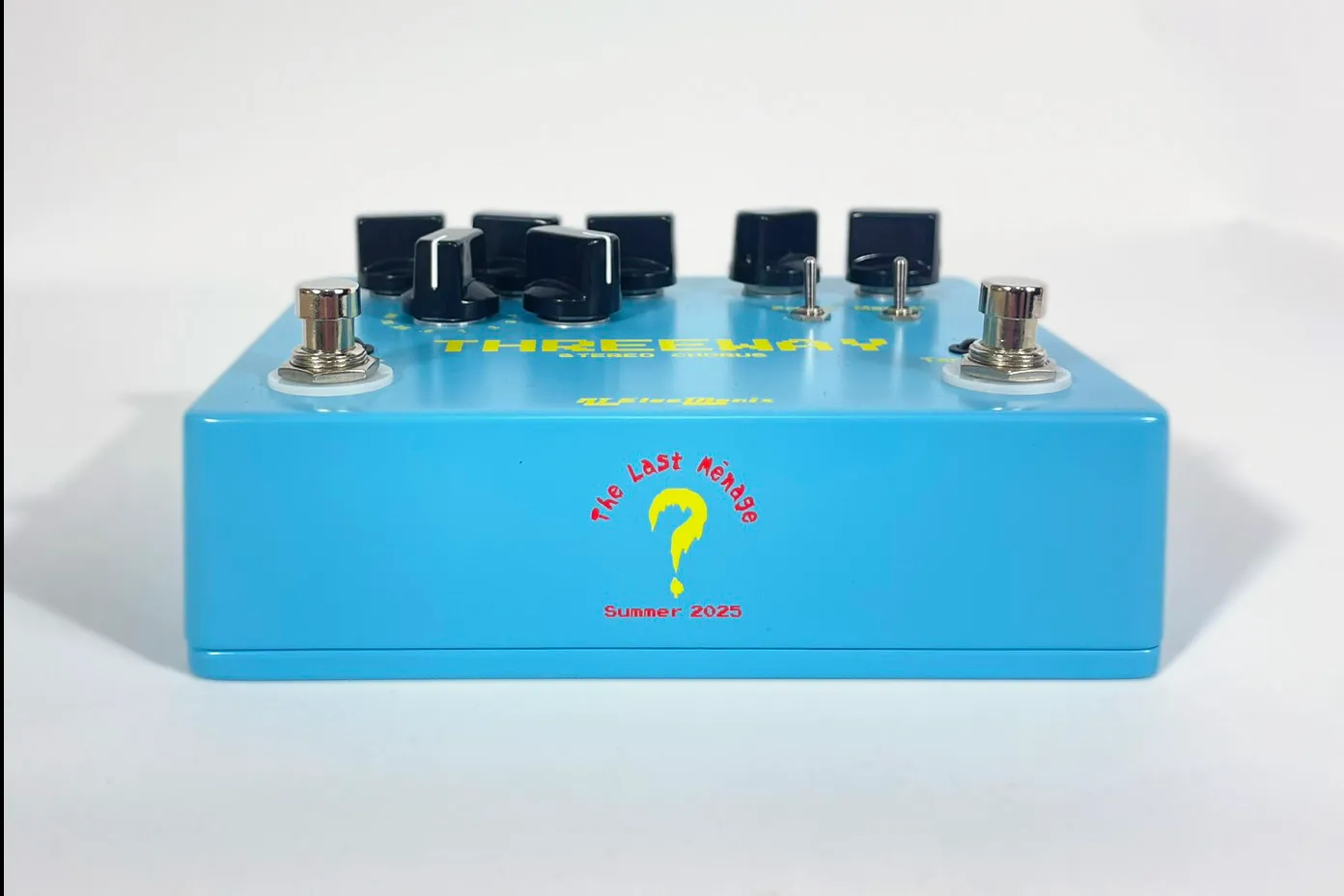 Front view of a light blue The Last Ménage Threeway stereo chorus pedal.